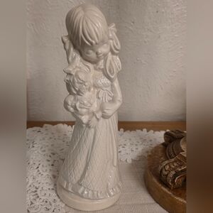 Ceramic Bisque Figurine of Girl Holding Dog Collectable